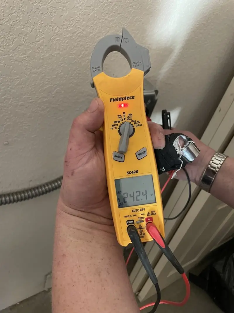 Voltage testing with clamp meter during Ceiling Fan Installation in Stow